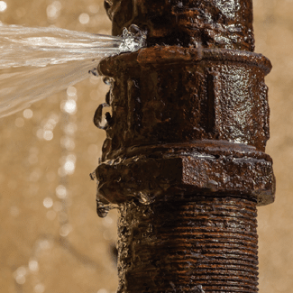 A burst pipe indicating Claim 1: Water Damage