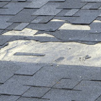 A roof missing several tiles, representing Claim 2: Roof Damage