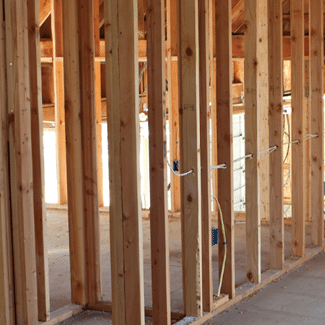 Wooden frames of a house under construction, representing possibilities for structural damages