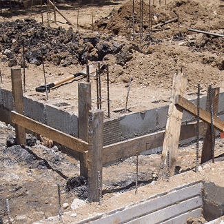 Unfinished house foundation, representing Claim 3: Foundation Damage