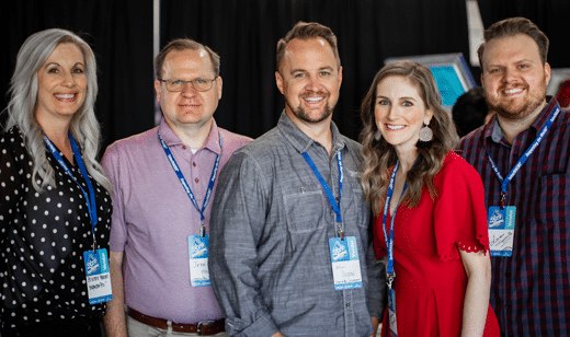 Team photo of the InspectorPro team at an event and promoting home inspection business insurance policies. From left to right: Brianne Smith, Jeff Hill, Will Colton, Stephanie Jaynes, and Adam Jaynes