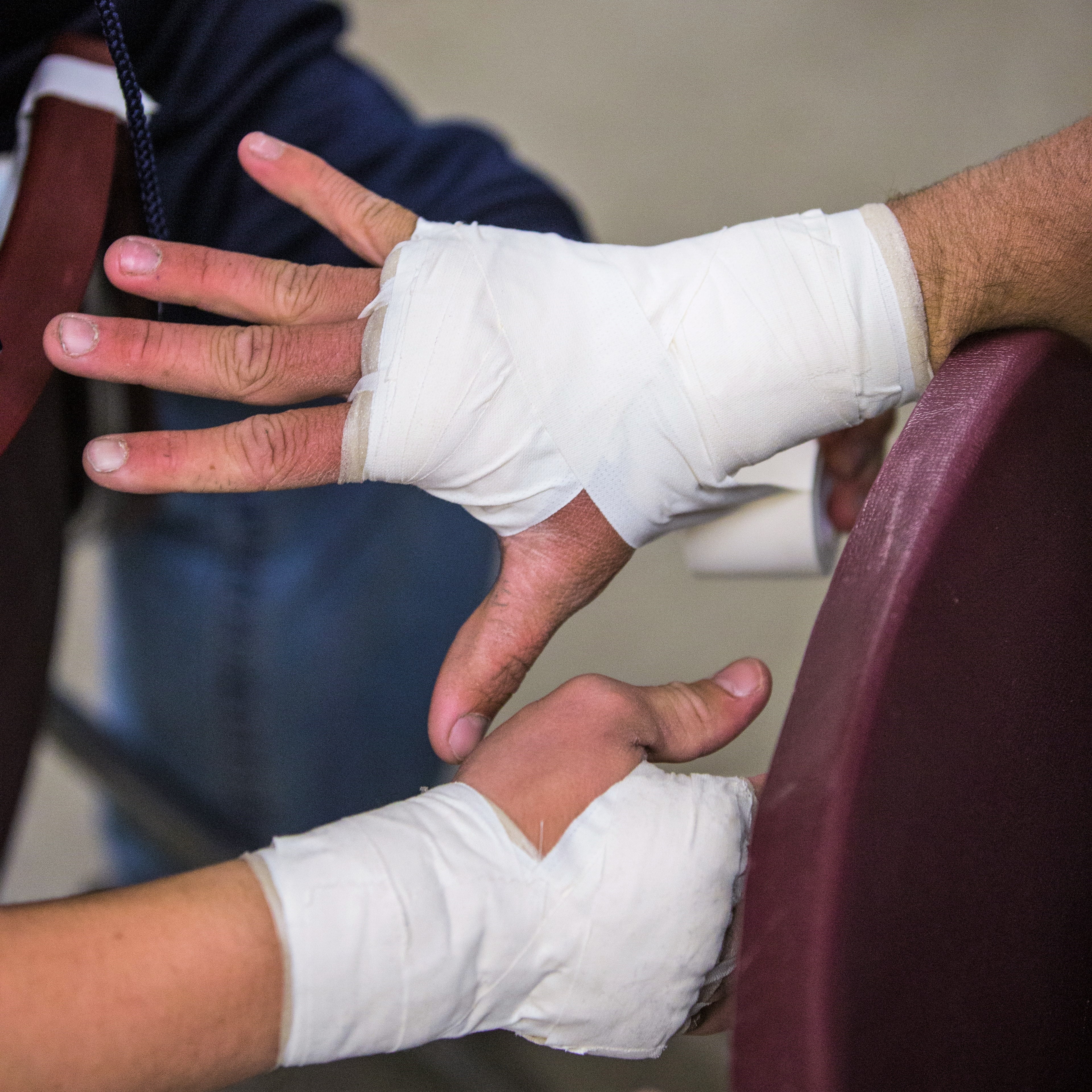 Bandaged hands, showing importance of workers' comp and PPE for home inspectors