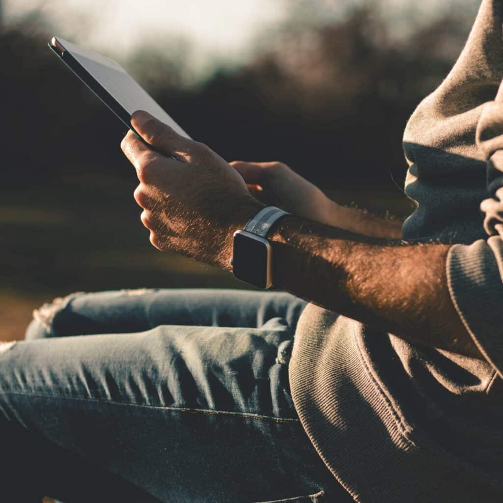 Close up of man holding tablet