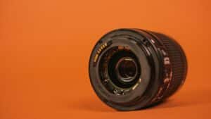 camera lens on orange background