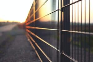 close-up of fence with sunlight reflecting off of it