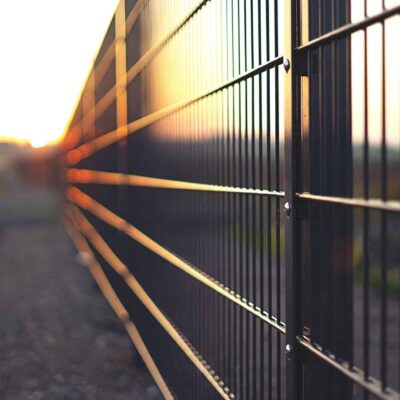 close-up of fence with sunlight reflecting off of it