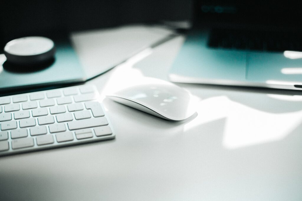 keyboard and computer mouse in shadow