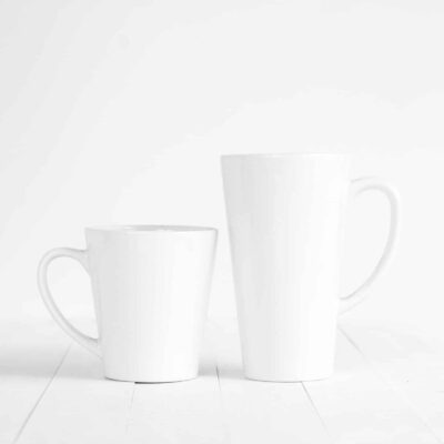 two white ceramic mugs on white background