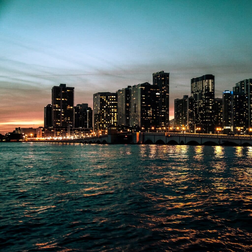 View of skyscrapers in Miami, Florida from the ocean at sunset