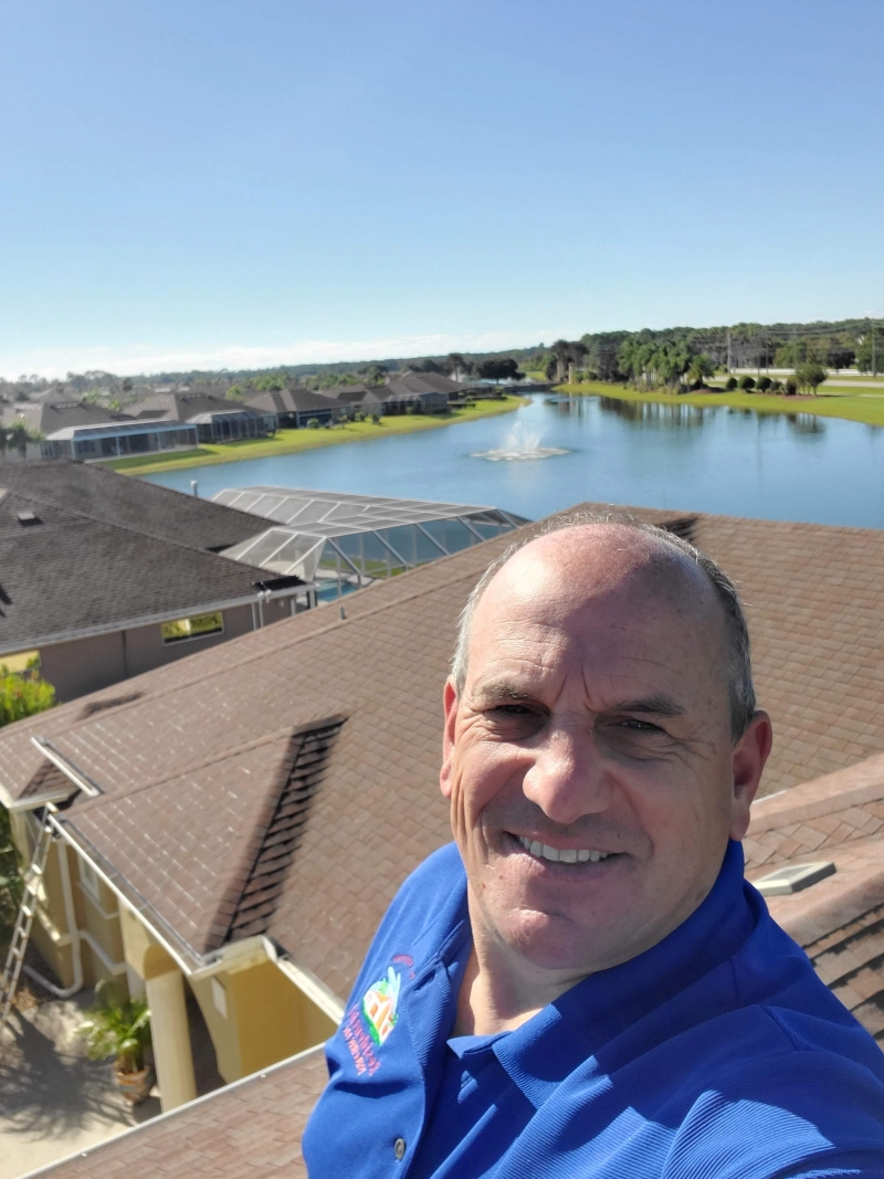 Vince Cardone takes a selfie on a roof of a residential neighborhood in Florida.