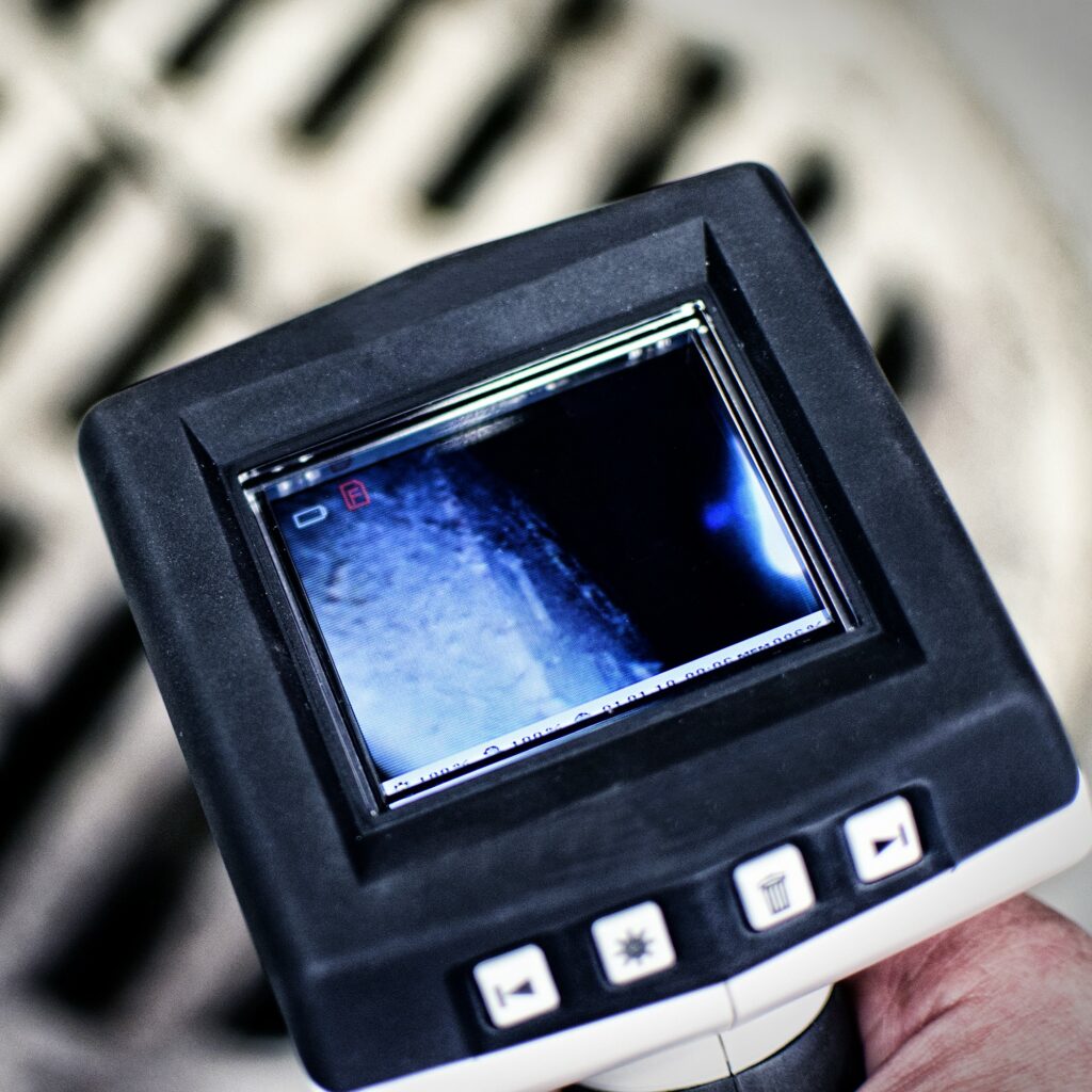 Close-up image of a sewer scope screen during an ancillary home inspection service.