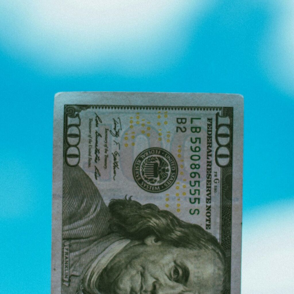 Zoomed-in image of $100 American bill, used to indicate home inspector job growth opportunities.