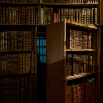 An antiquated library bookshelf swings out, acting as hidden doors in walls to reveal a secret dark room on the other side. As inspectors might see when inspecting houses with secret rooms and passageways, these spaces can be tricky to find.